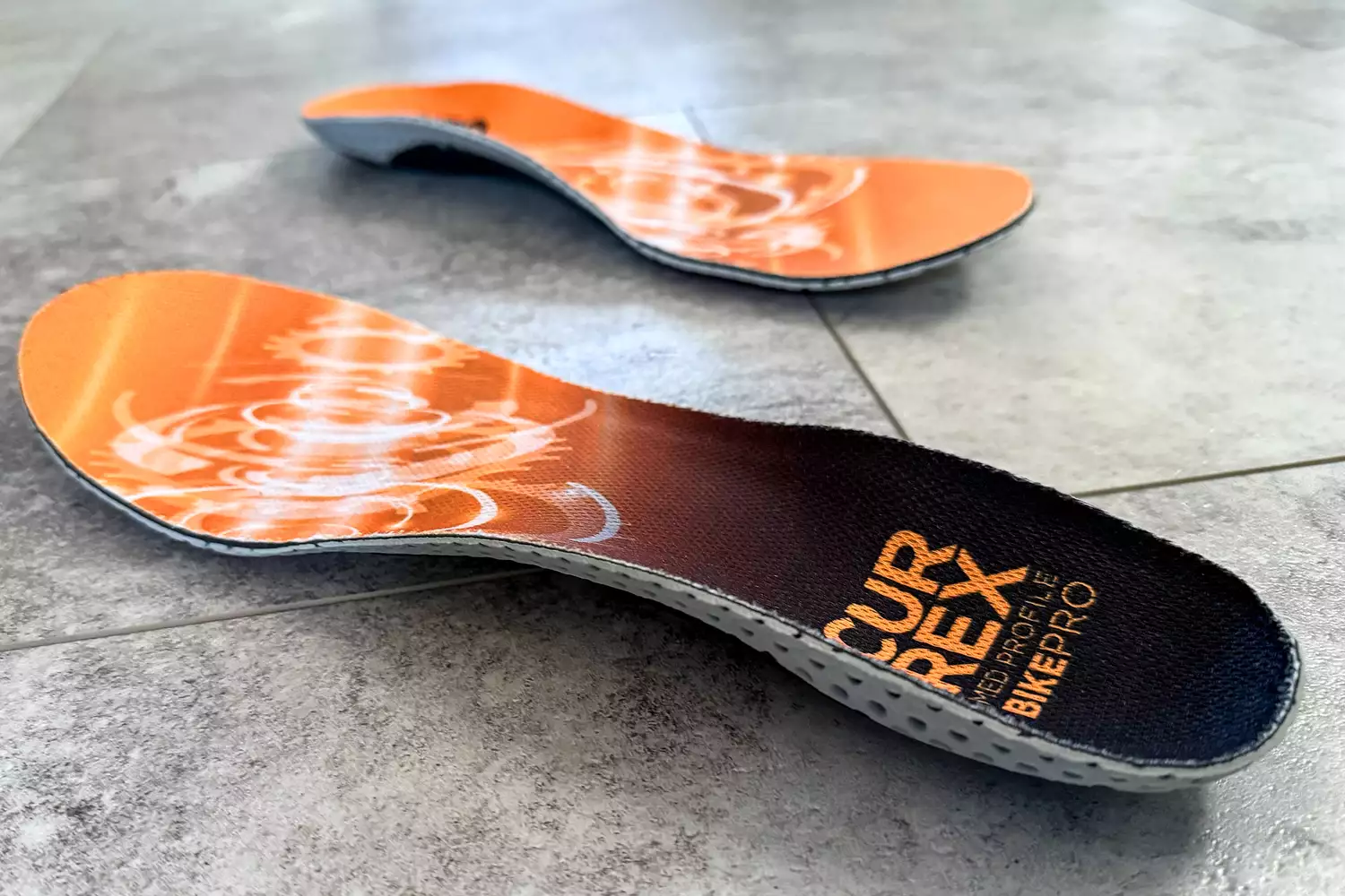 The CURREX BIKEPRO Insoles on a tile floor