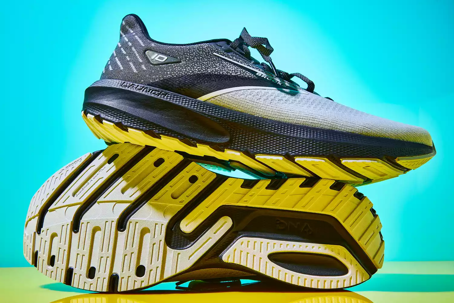 Brooks Launch 10 on a shiny yellow surface