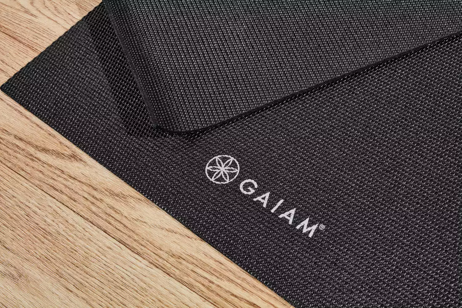 Close-up of the logo on a Gaiam Classic Solid 5mm Yoga Mat