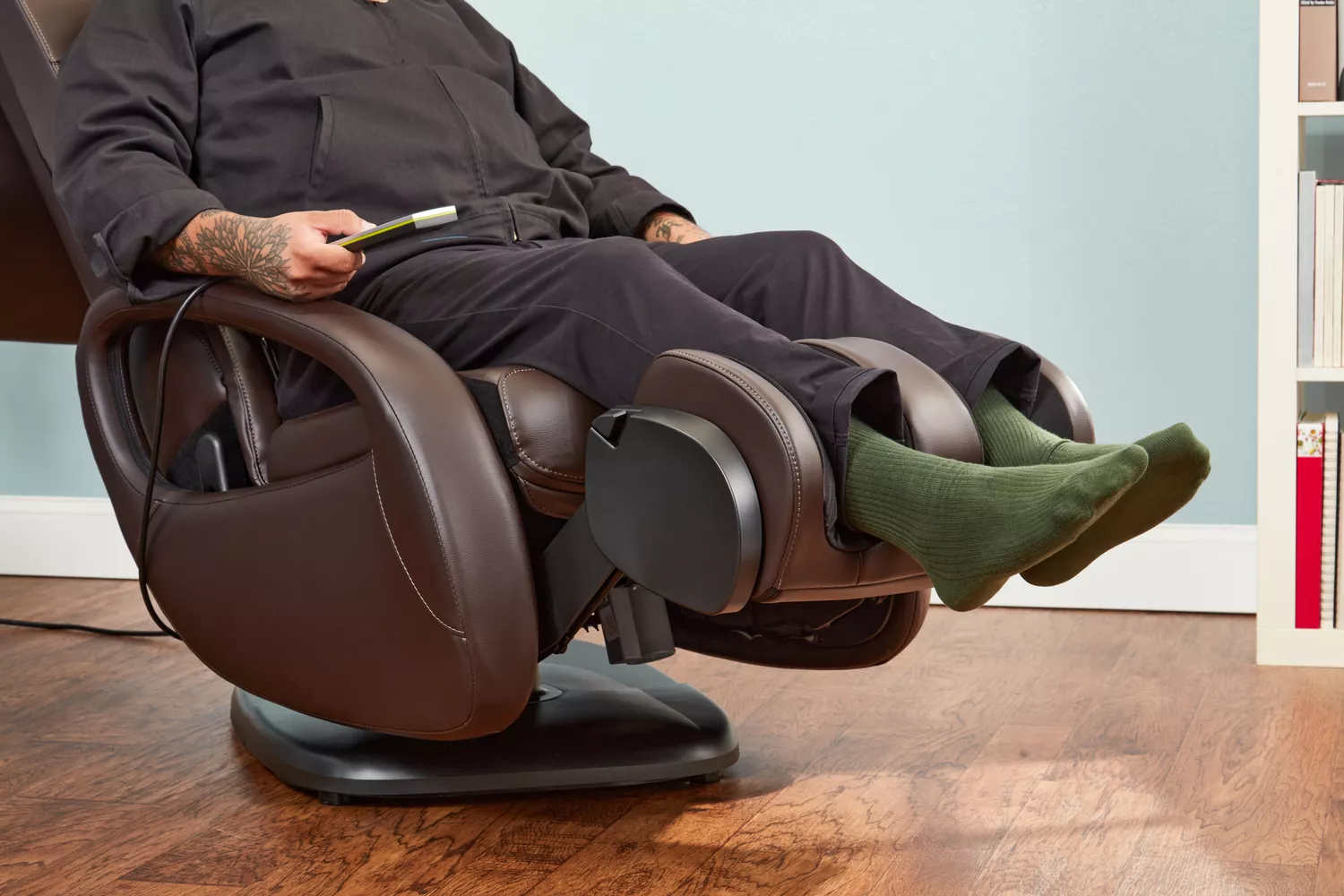 A person reclining in a Human Touch WholeBody 7.1 Massage Chair