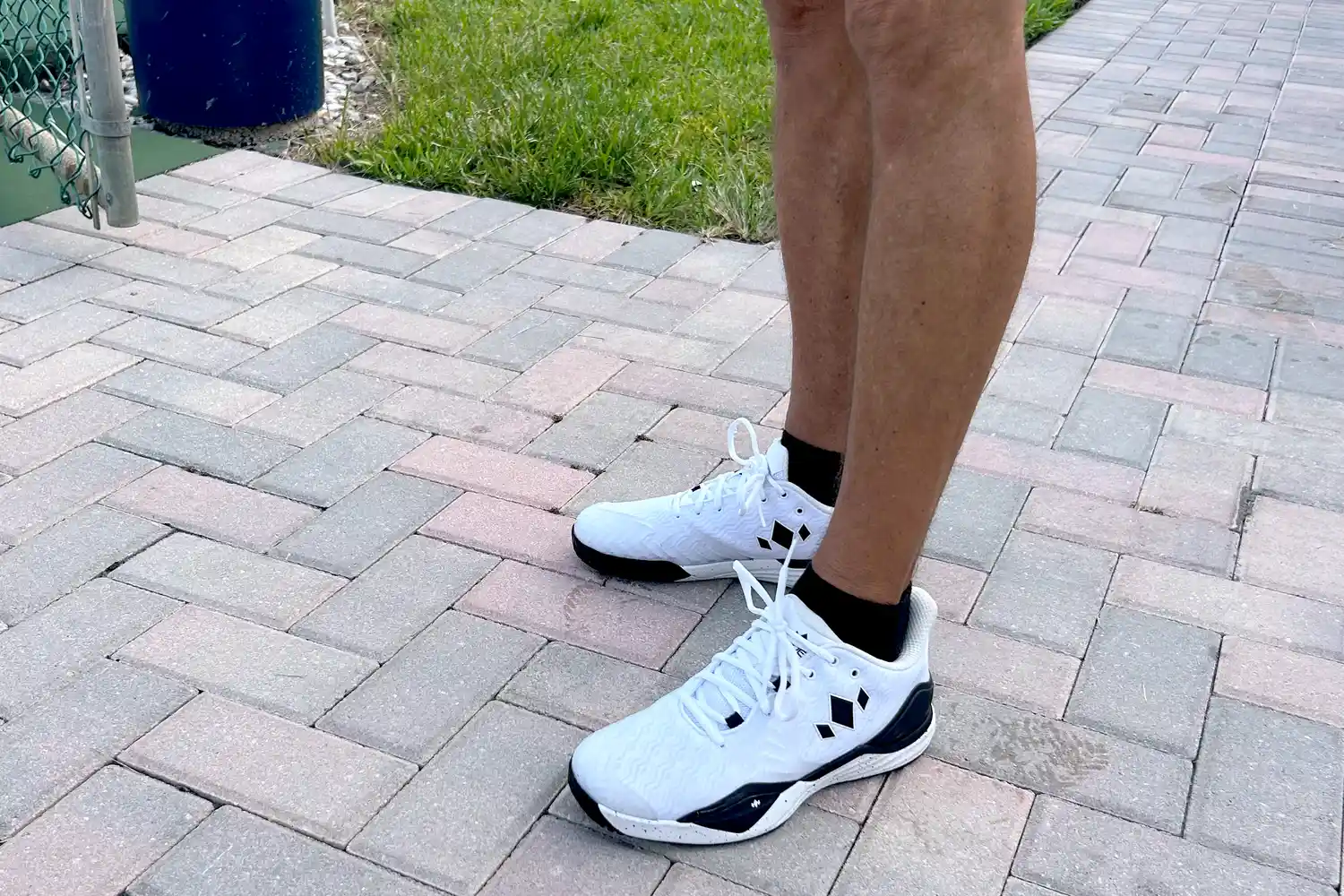A side view of a person wearing the Diadem Court Burst Pickleball Shoes