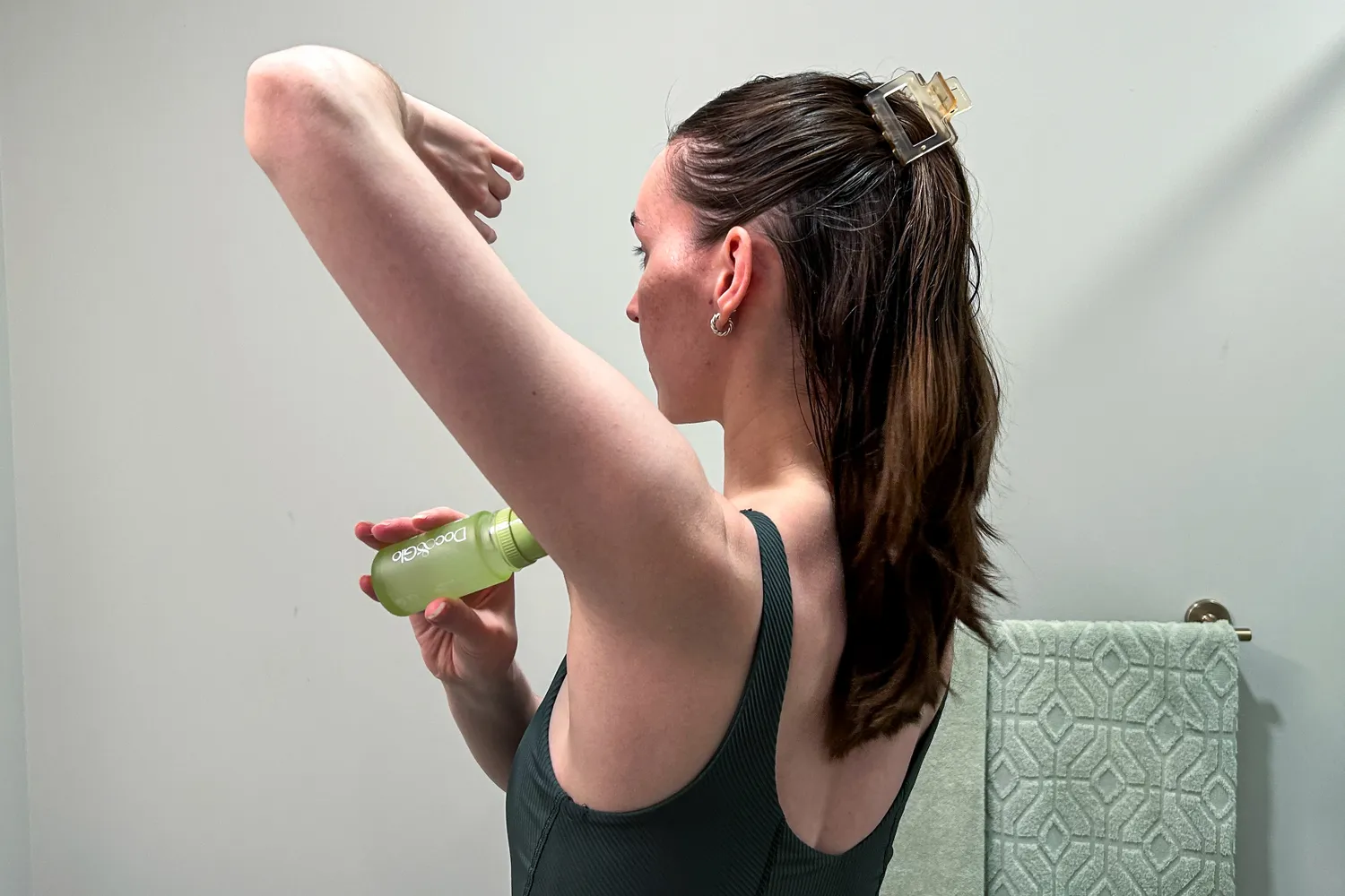 A person applies Doc&Glo No. 3161 Game Changing Deodorant