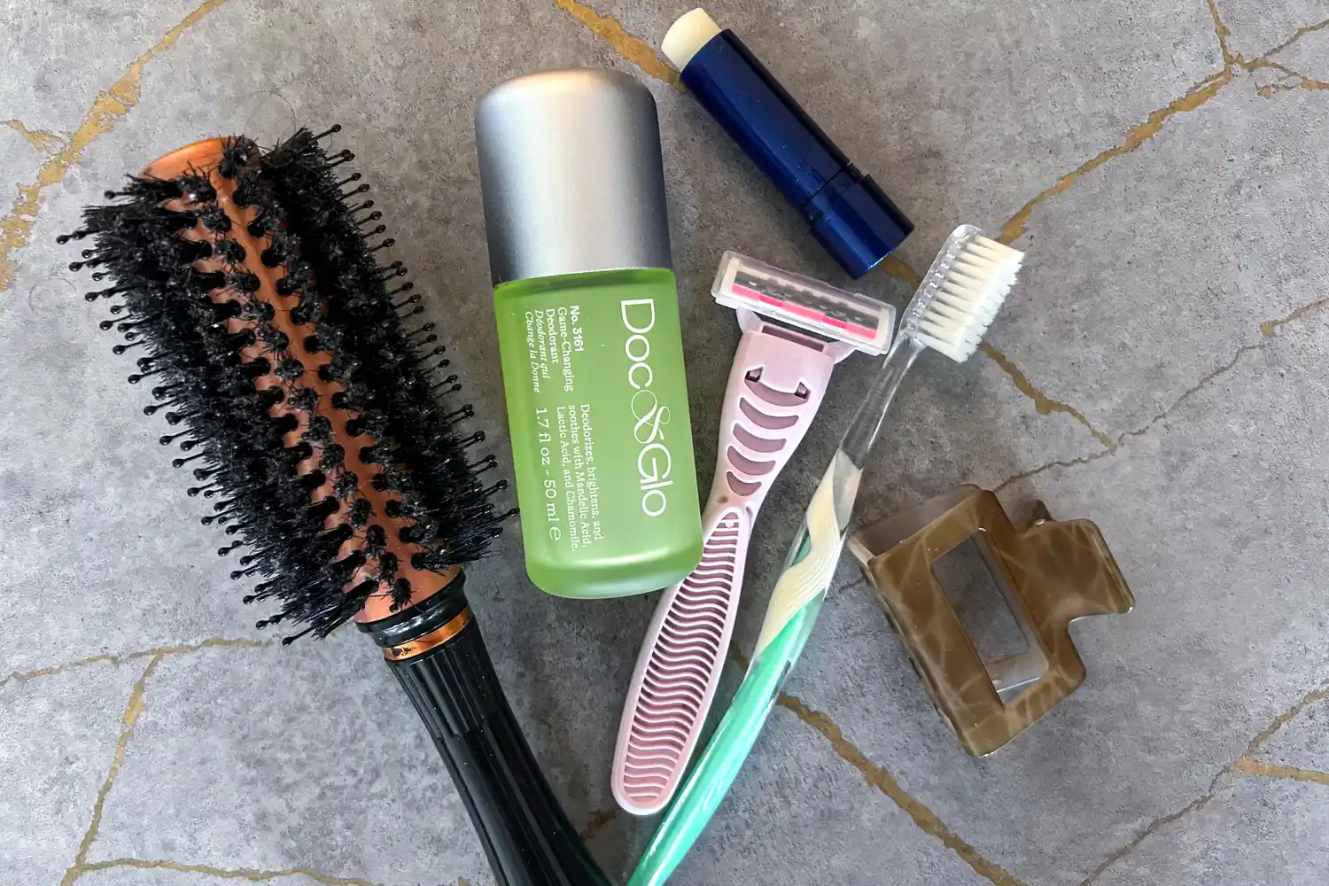 The Doc&Glo No. 3161 Game Changing Deodorant next to other toiletries 