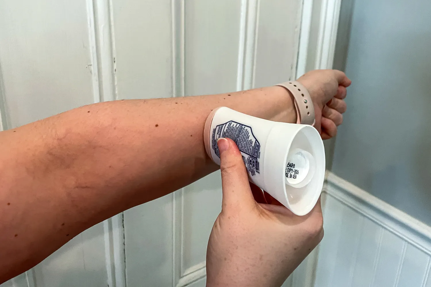 A person applies Dove Even Tone 48-Hour Antiperspirant & Deodorant Stick to their arm