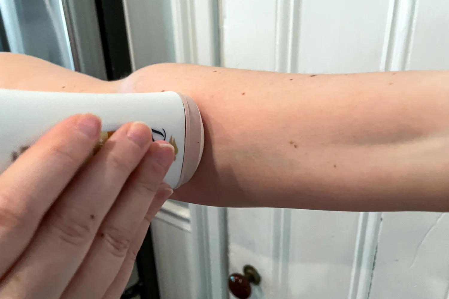 A person applies the Dove Even Tone 48-Hour Antiperspirant & Deodorant Stick to their arm