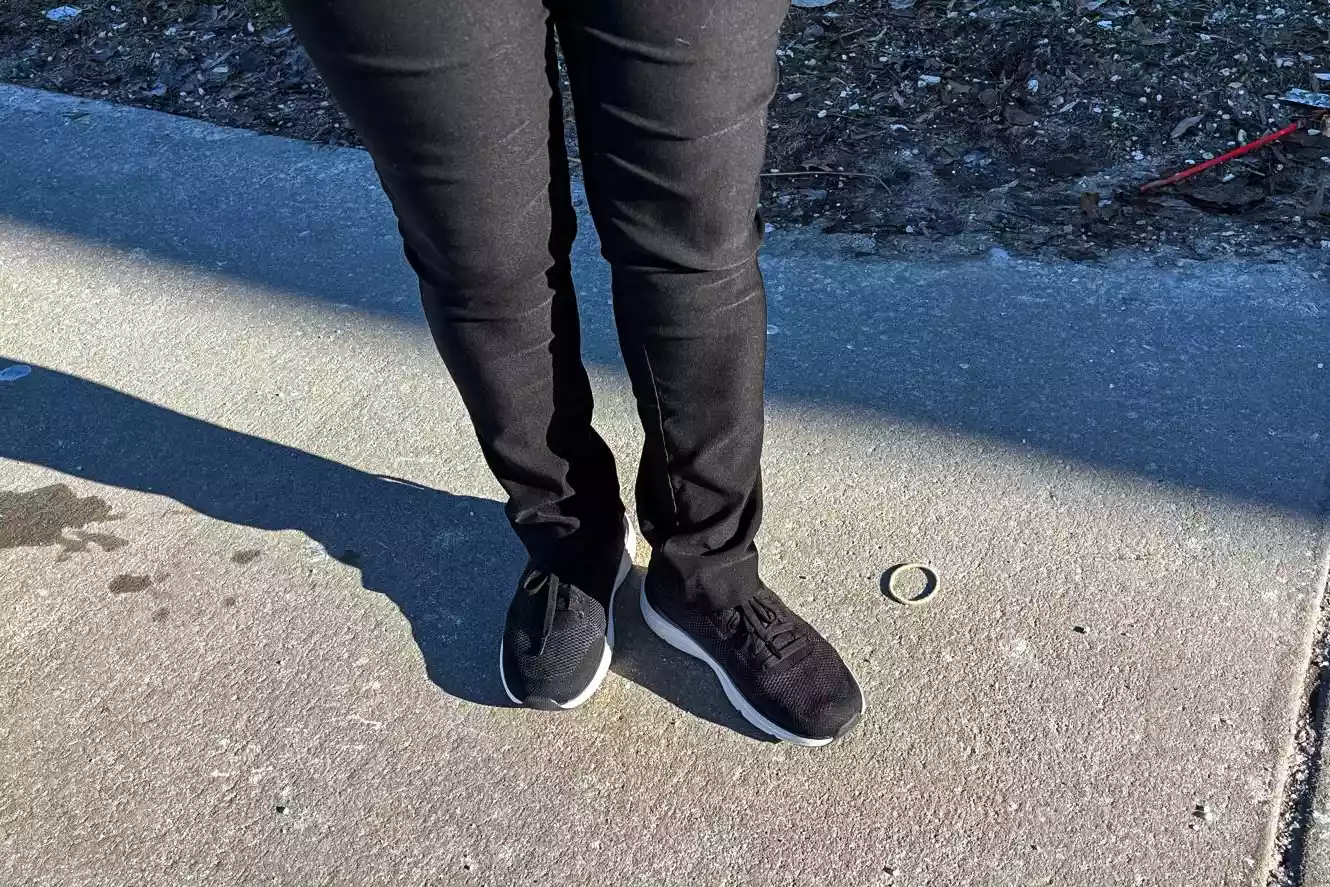 The Dr. Scholl's Women's Feel Support Lace Up Sneakers worn on concrete