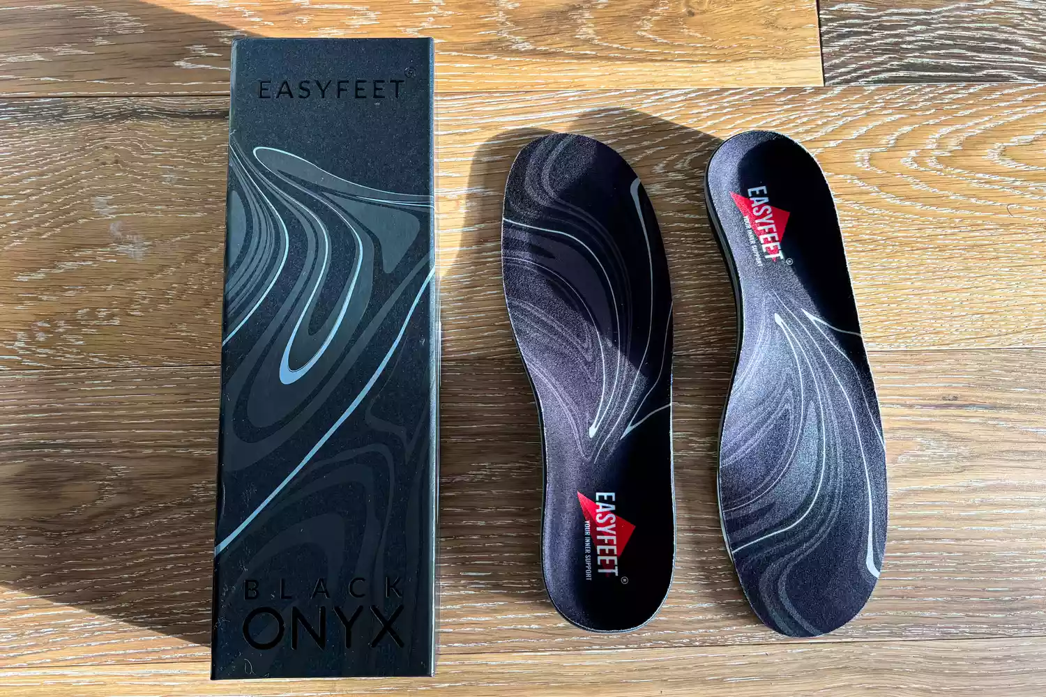 The EasyFeet Black Onyx Pain Relief Premium Orthotics next to the box