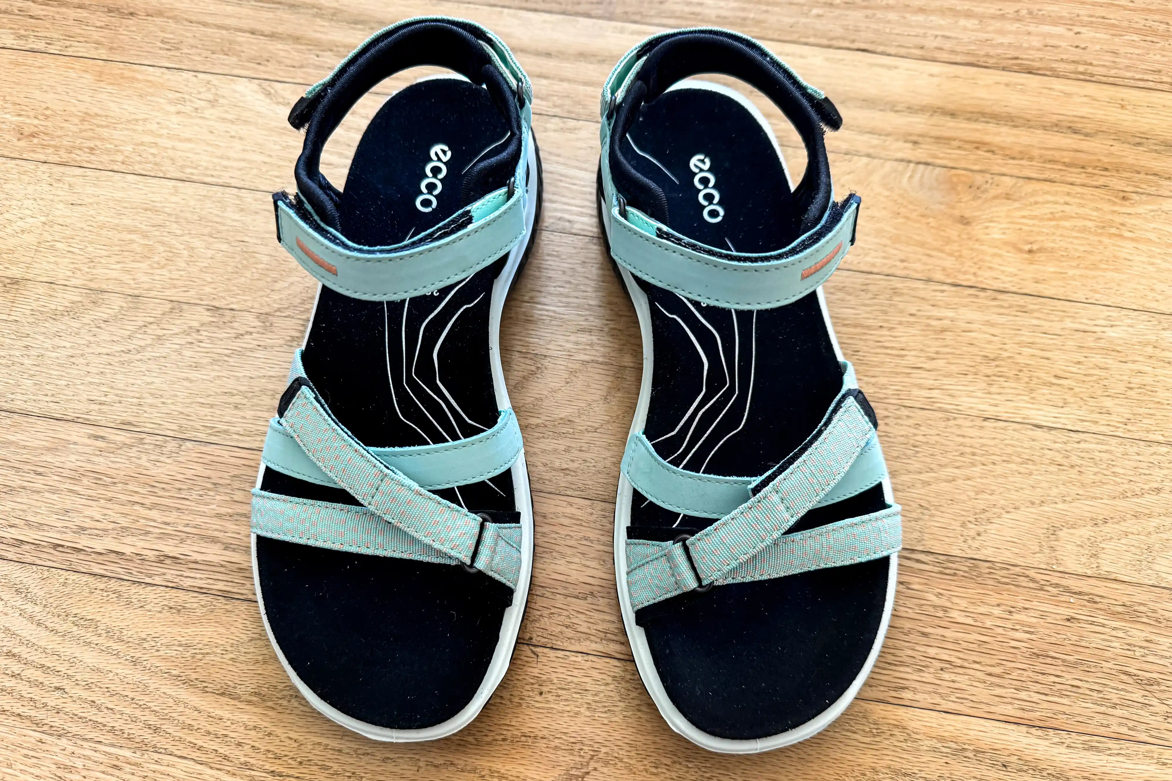 An overhead view of the ECCO Offroad Roam Women's Nubuck Outdoor Sandals on wood