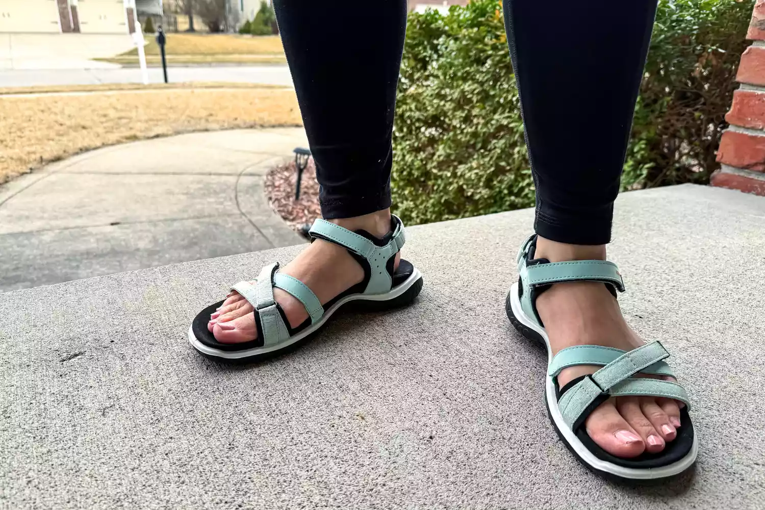 A close-up of two feet posed in the ECCO Offroad Roam Women's Nubuck Outdoor Sandal