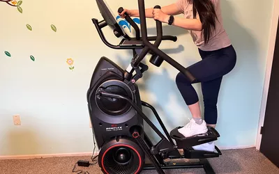 A person exercising on the BowFlex Max Total 16