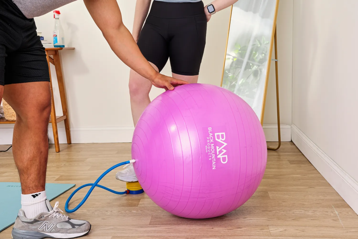 A person pumps up the Black Mountain Professional Grade Stability Ball
