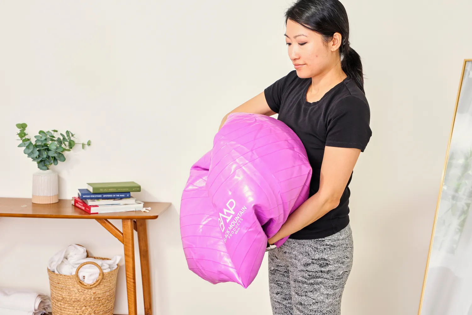 A person deflates the Black Mountain Professional Grade Stability Ball