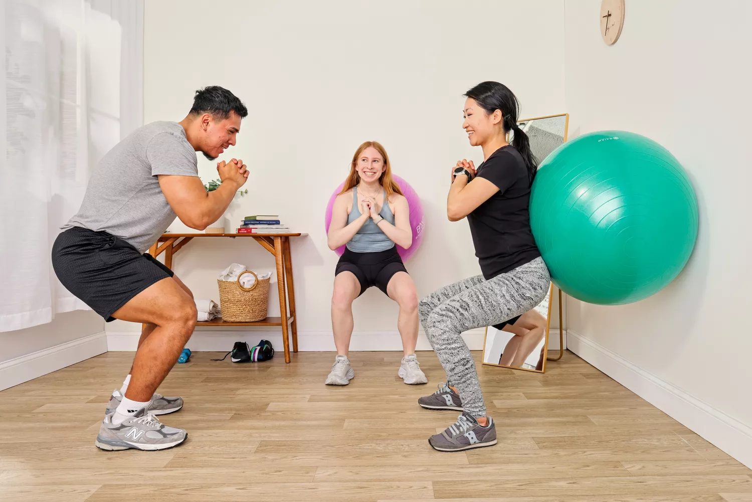 A person exercises using the Gaiam Total Body Balance Ball Kit
