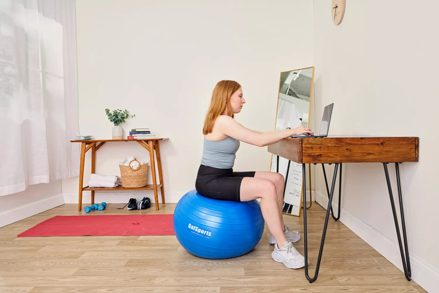 A person sits on the GalSports Anti-Sport Yoga Ball