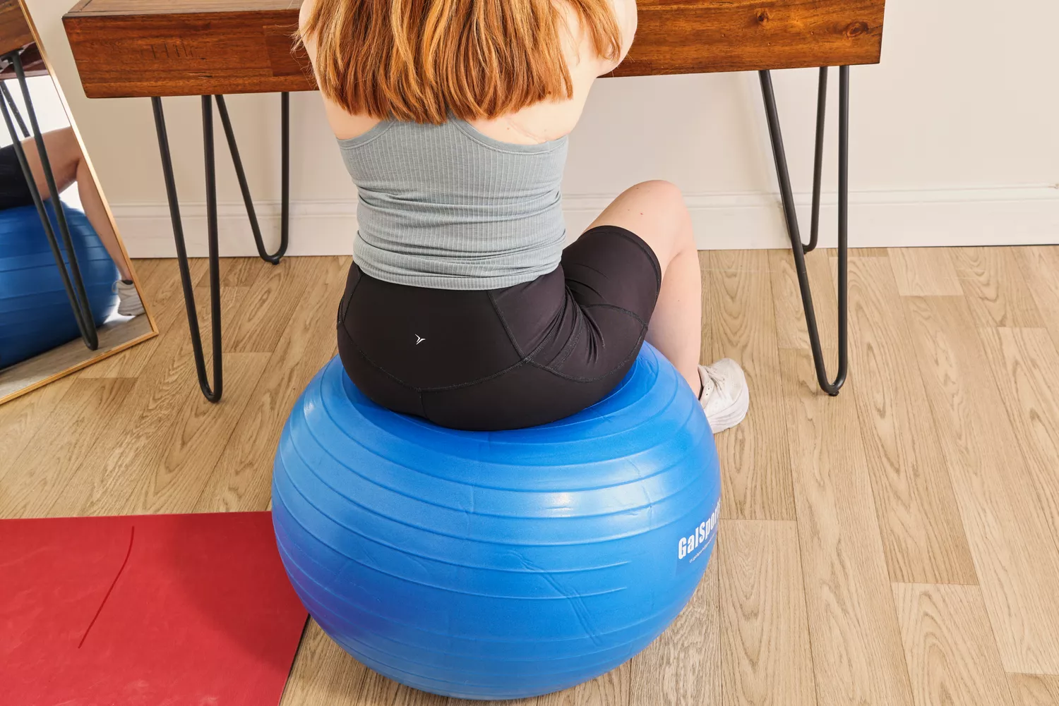 A person sits on the GalSports Anti-Sport Yoga Ball