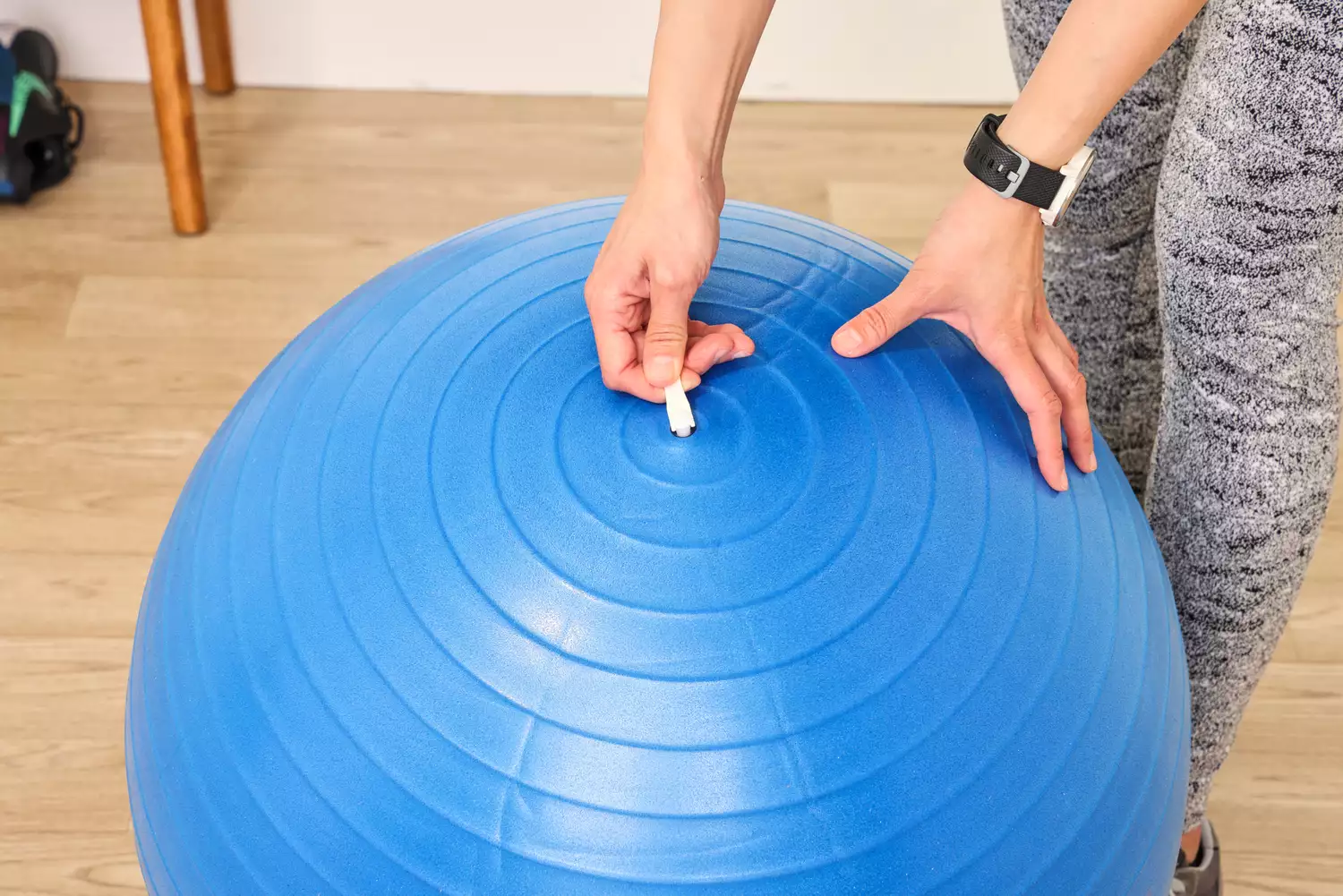 A person removes the plug on the GalSports Anti-Sport Yoga Ball