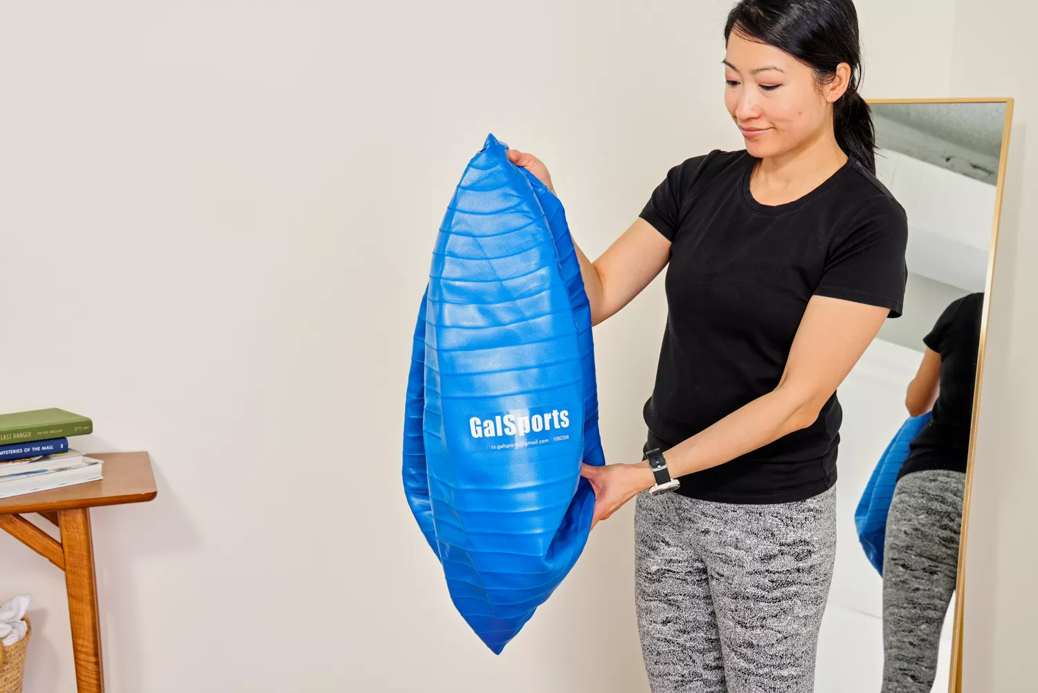 A person deflates the GalSports Anti-Sport Yoga Ball
