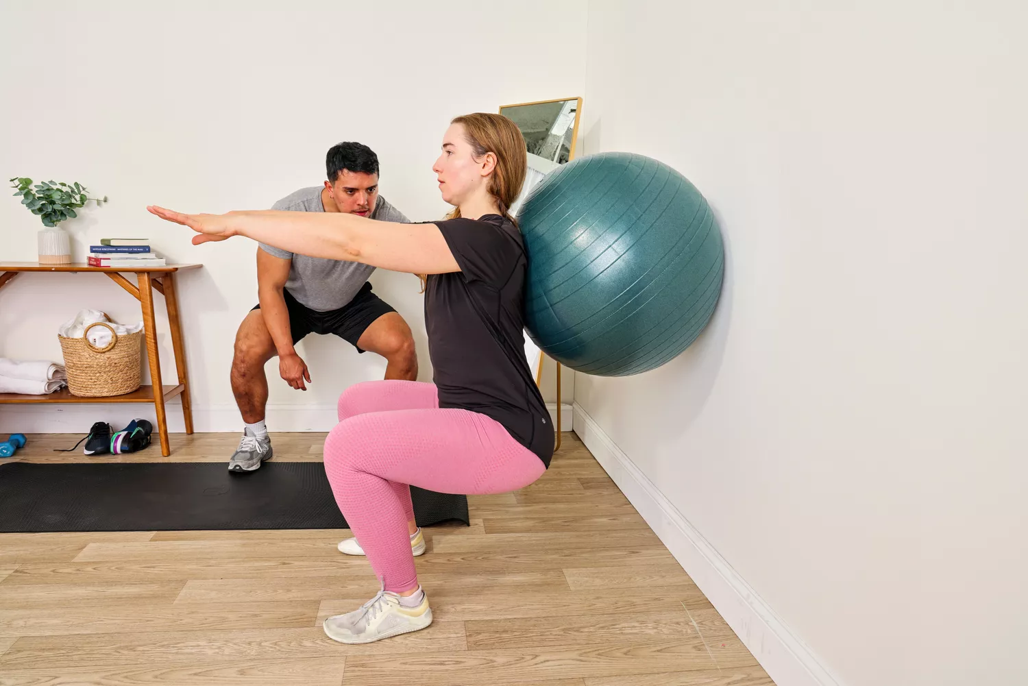 A person exercises using the Power Systems Versa Ball Pro Stability Ball