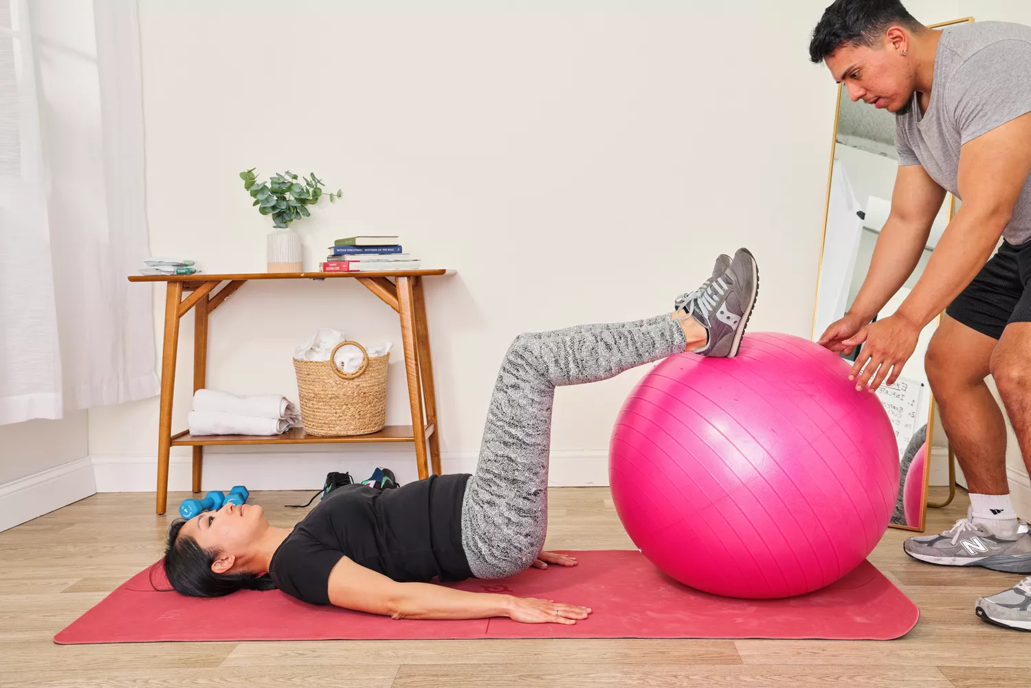 A person exercises using the SmarterLife Workout Exercise Ball
