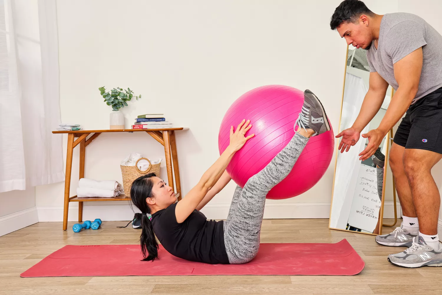 A person exercises using the SmarterLife Workout Exercise Ball
