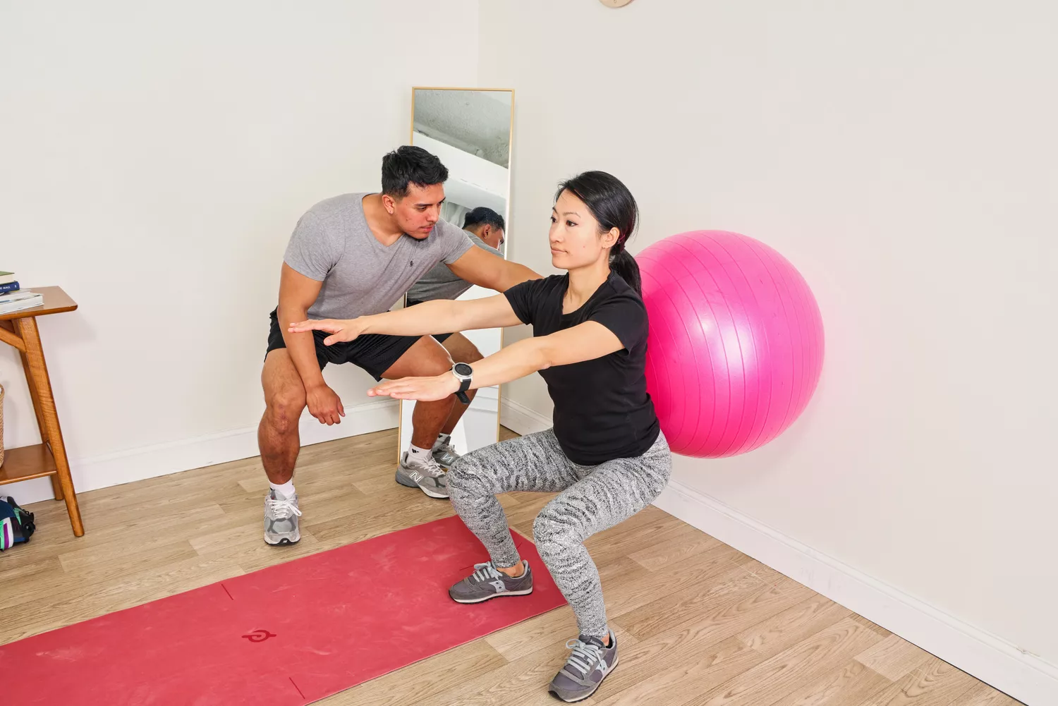 A person exercises using the SmarterLife Workout Exercise Ball