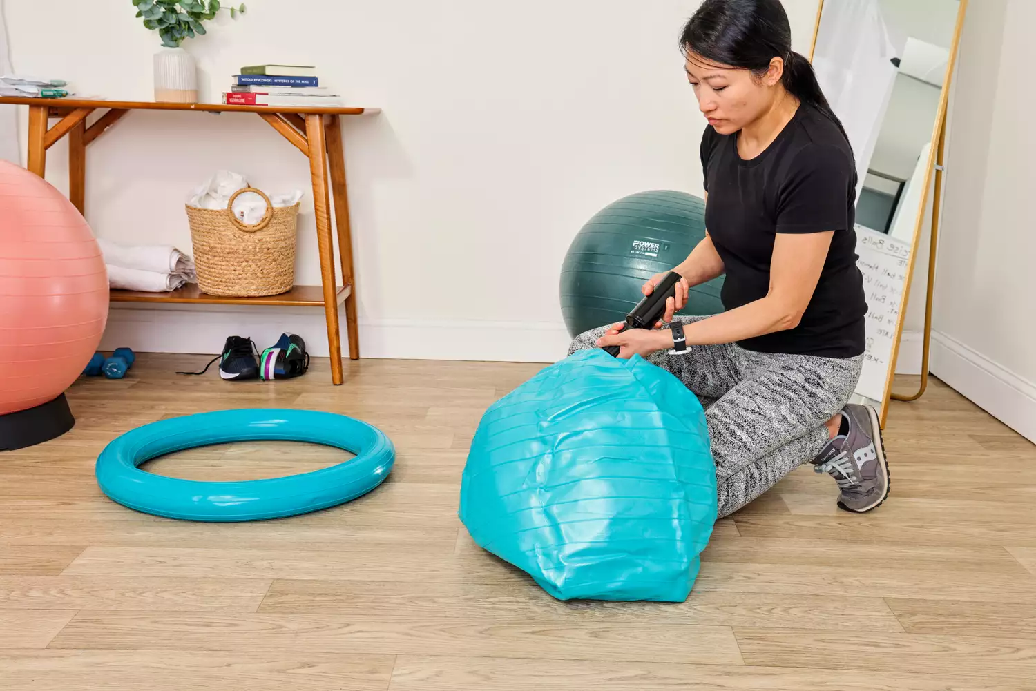 A person inflates the Trideer Exercise Ball Chair