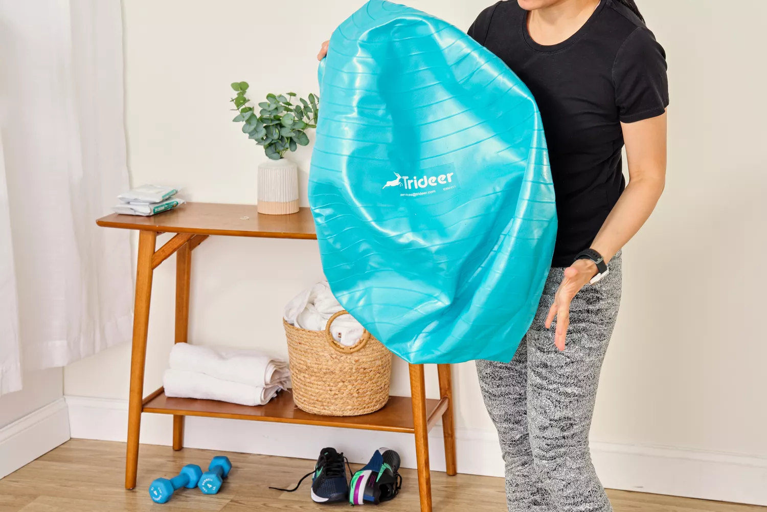 A person deflates the Trideer Exercise Ball Chair