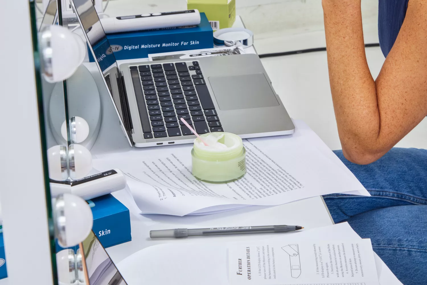 DHC Olive Virgin Oil Essential Cream placed on table while testing