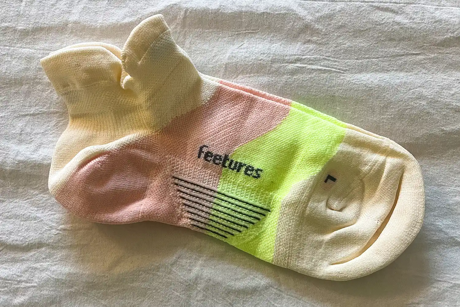 A pair of Feetures Elite Ultra Light Tab Socks before wearing
