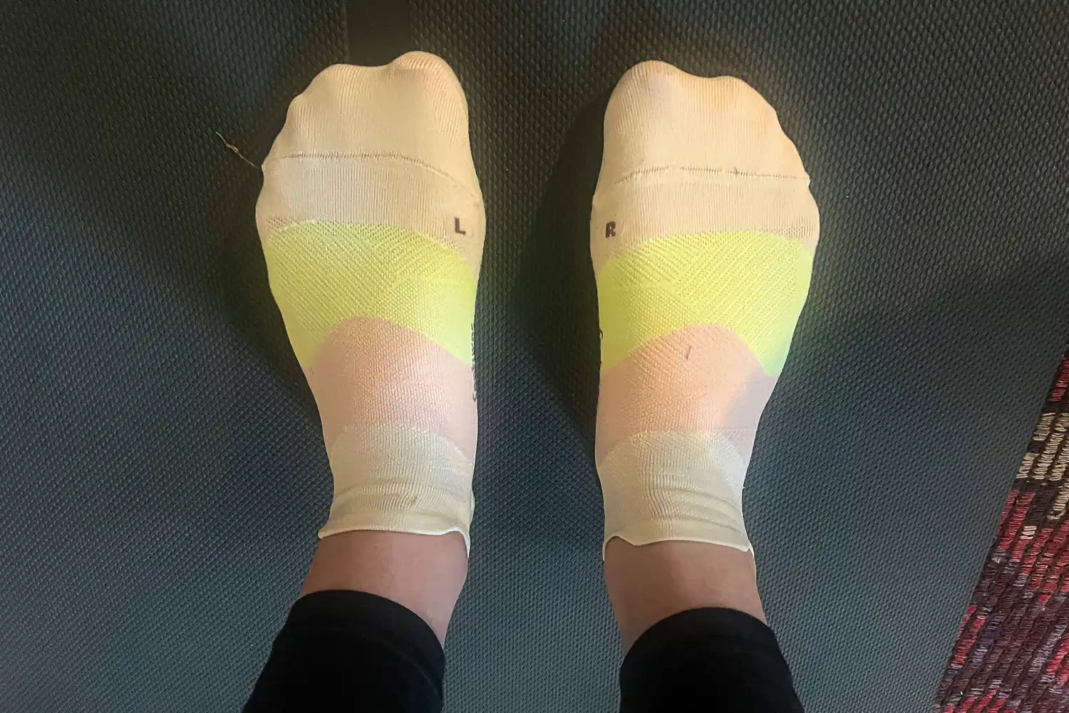 An overhead view of a person wearing the Feetures Elite Ultra Light Tab Socks