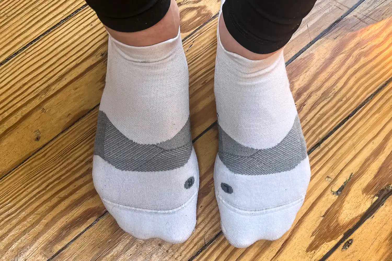 An overhead view of a person wearing the Feetures Merino 10 Max Cushion Tab Socks