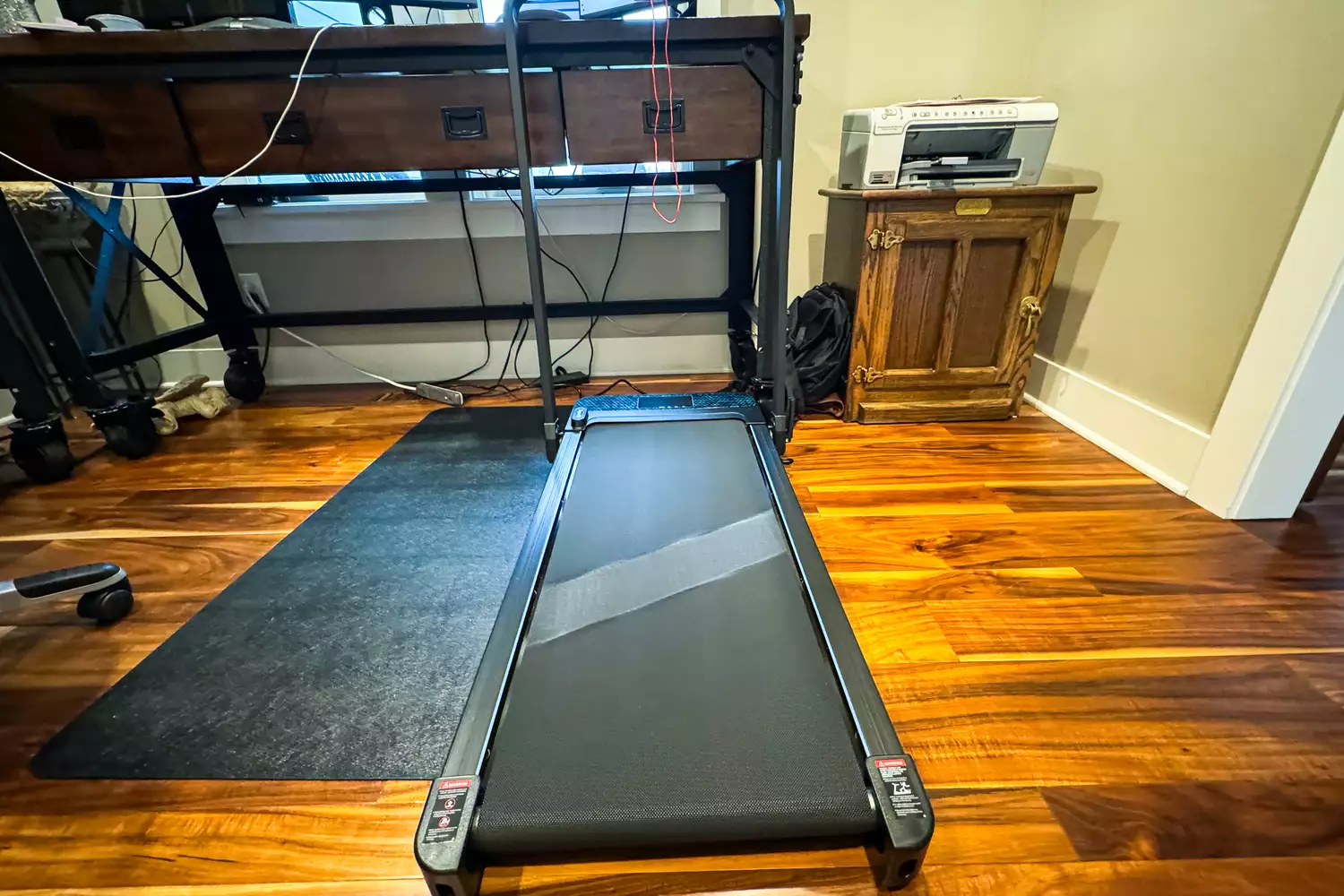 The GoPlus 2 in 1 Folding Treadmill on a wooden floor