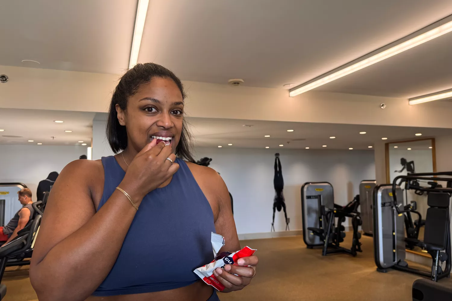 A person eats a GU Energy Chew