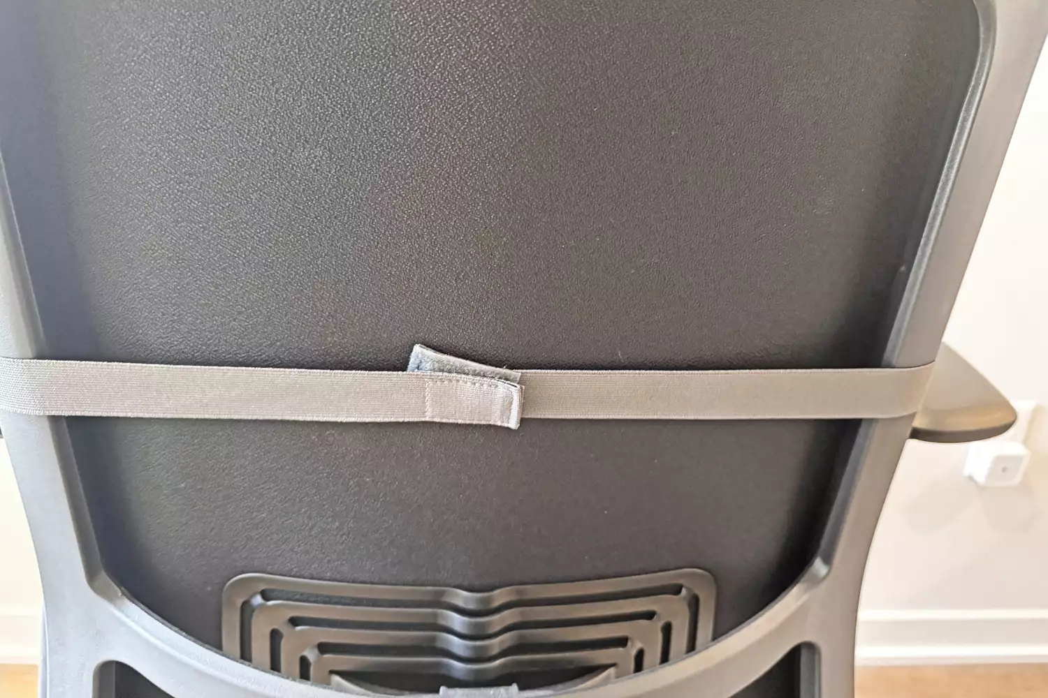 The back of the Homedics Shiatsu Elite II Massage Cushion with Soothing Heat on a chair