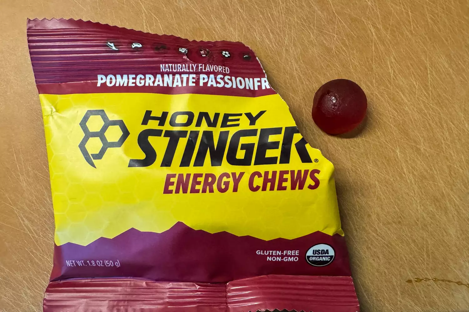 The Honey Stinger Organic Energy Chews packet with one removed