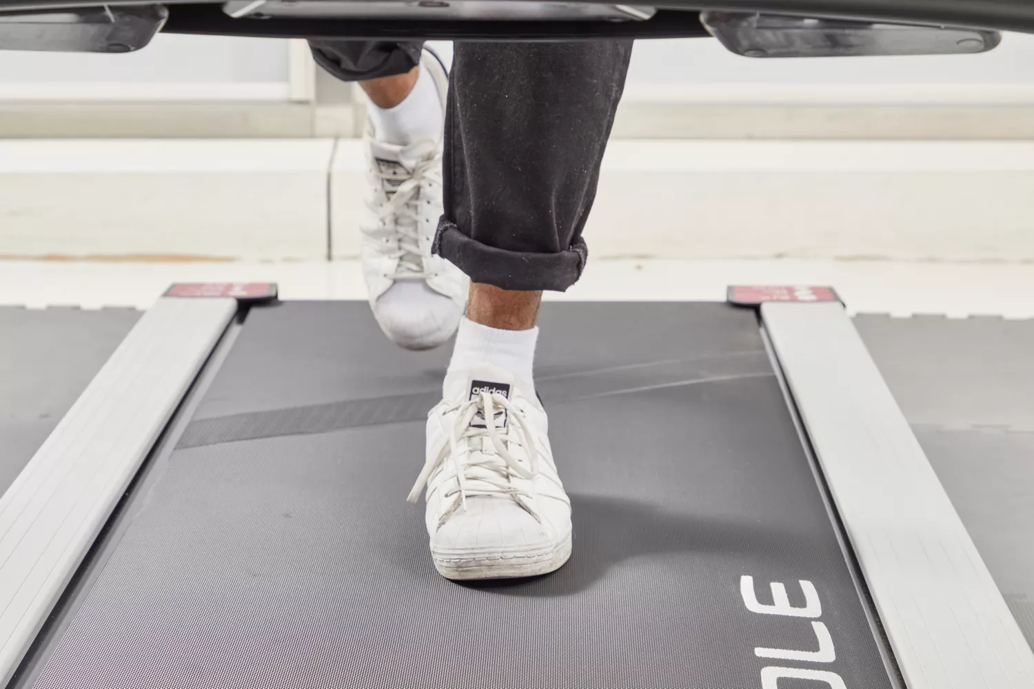 Feet walking on a treadmill