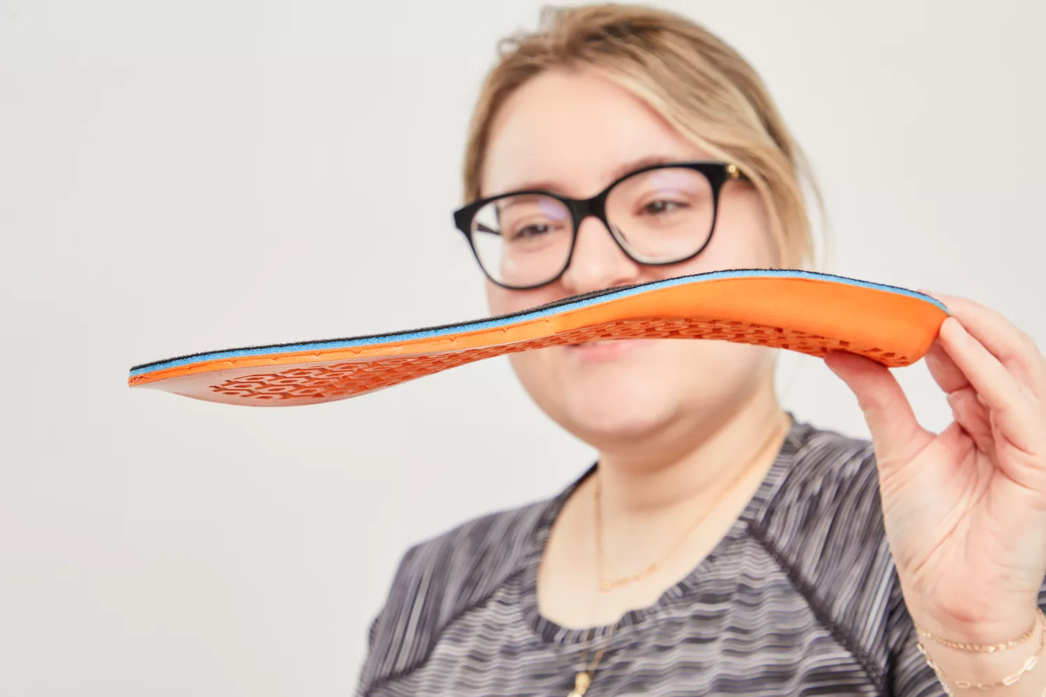 Person holding a Timberland Pro Anti-Fatigue Technology Insole