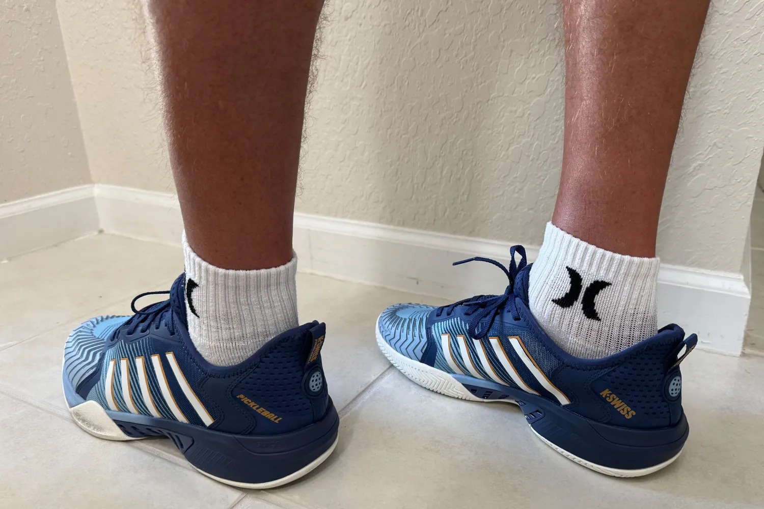 A side view of a person wearing the K-Swiss Men's Pickleball Supreme Shoes