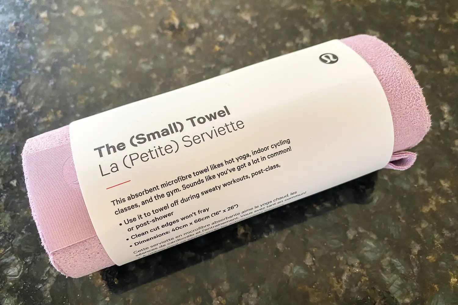 The lululemon The (Small) Towel rolled up in paper packaging