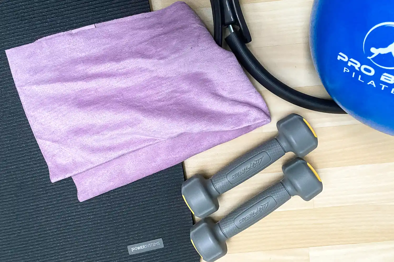 The lululemon The (Small) Towel folded on a gym floor