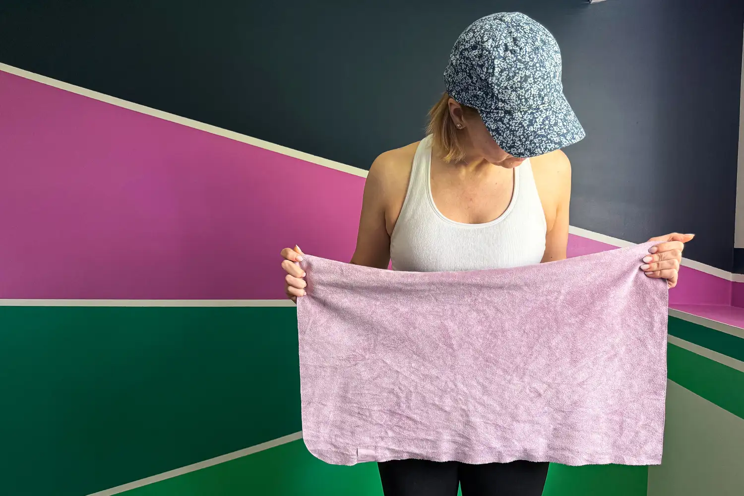 A person holds up the lululemon The (Small) Towel