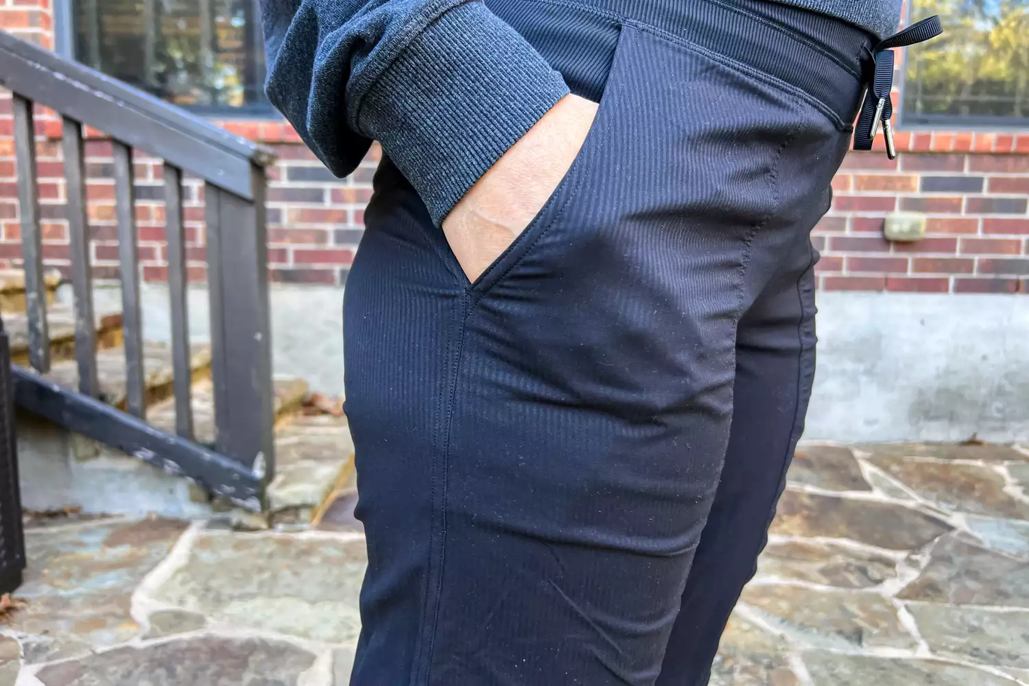 Person with hands in pockets of lululemon Dance Studio Mid-Rise Jogger 7/8 Length