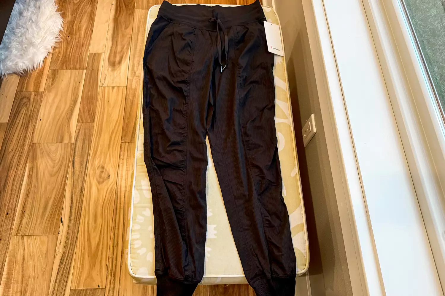 lululemon Dance Studio Mid-Rise Jogger Full Length laying on bench