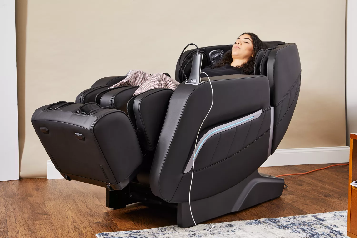 A person reclines in an iRest Zero Gravity Massage Chair