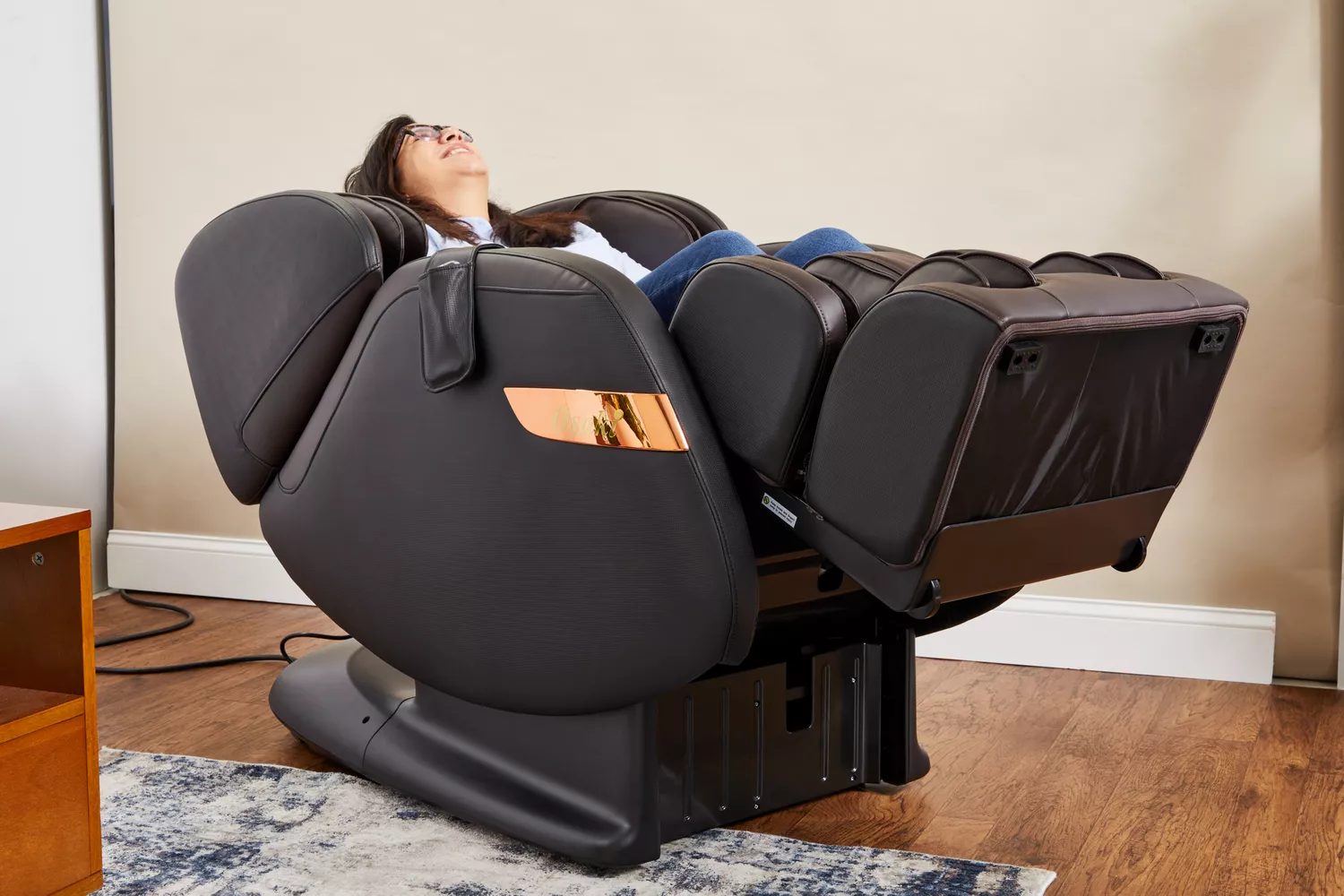 A person reclines in an Osaki OS-Champ Massage Chair