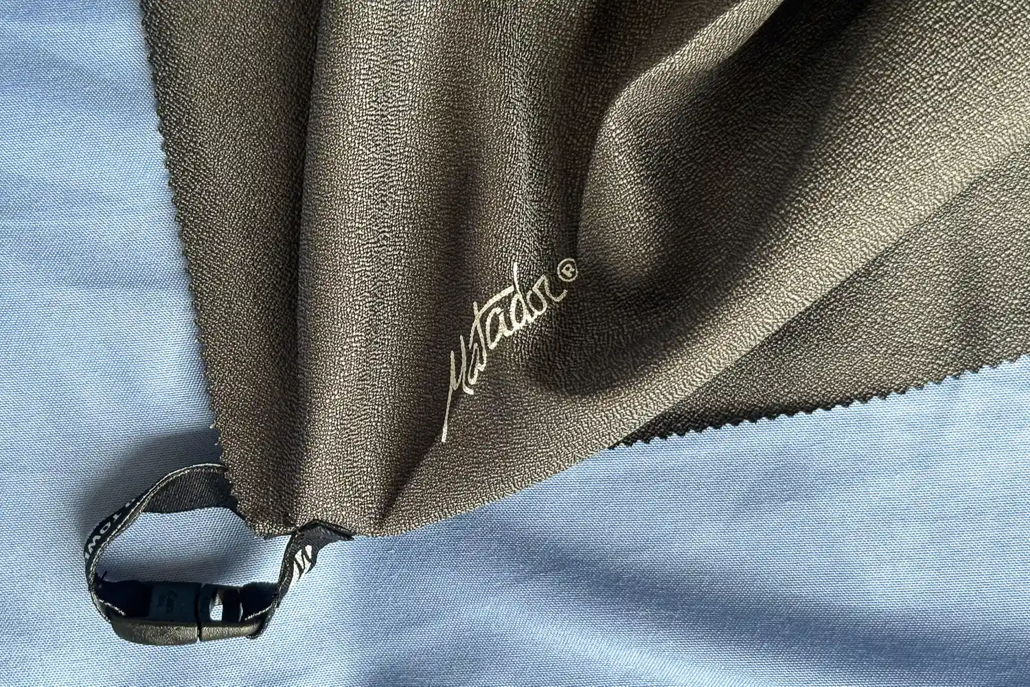 The strap and buckle on the Matador Nanodry Towel