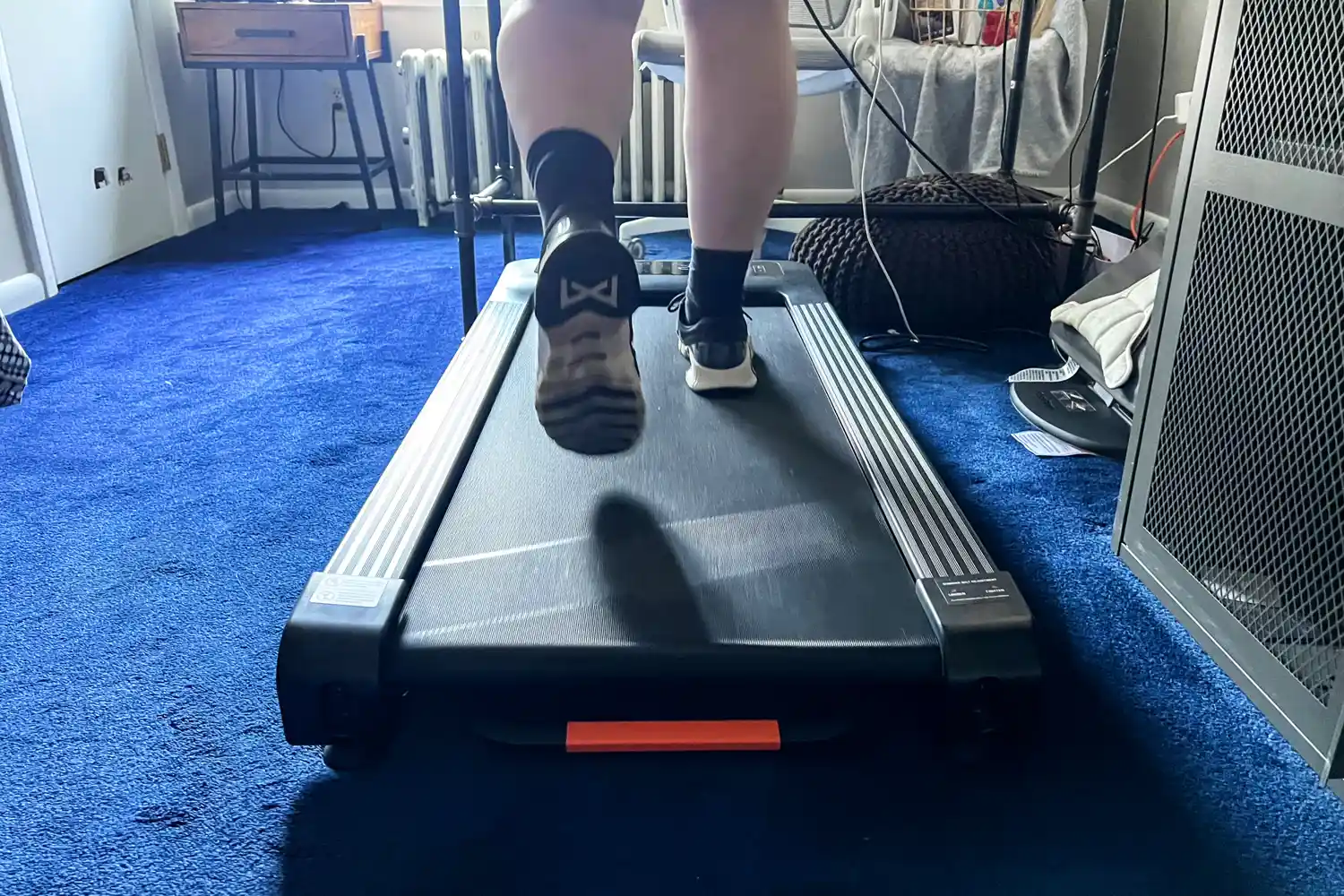 A person walks on the Merach NovaWalk W50 TrekPad with Incline