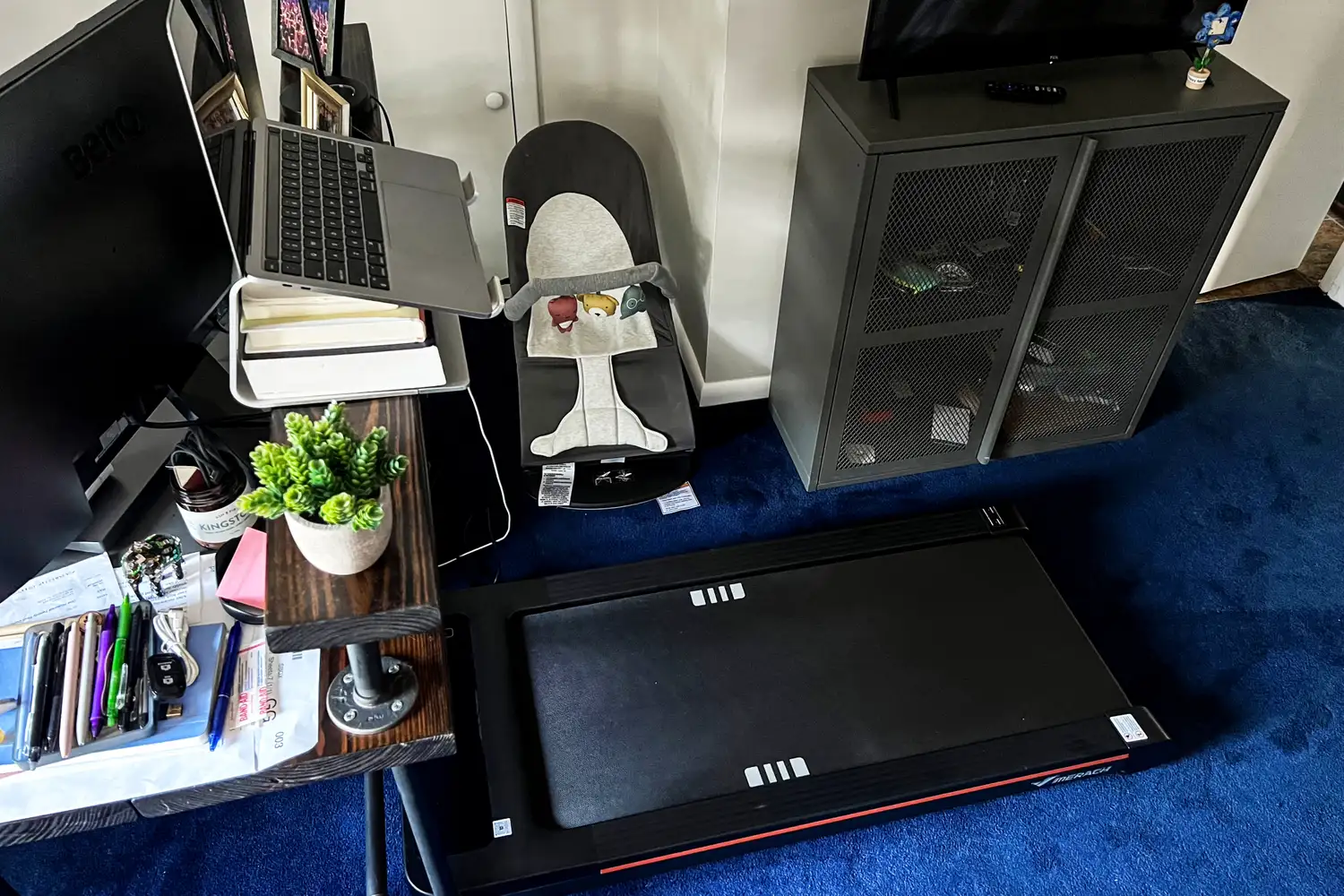 An overhead view of the Merach NovaWalk W50 TrekPad with Incline under a desk