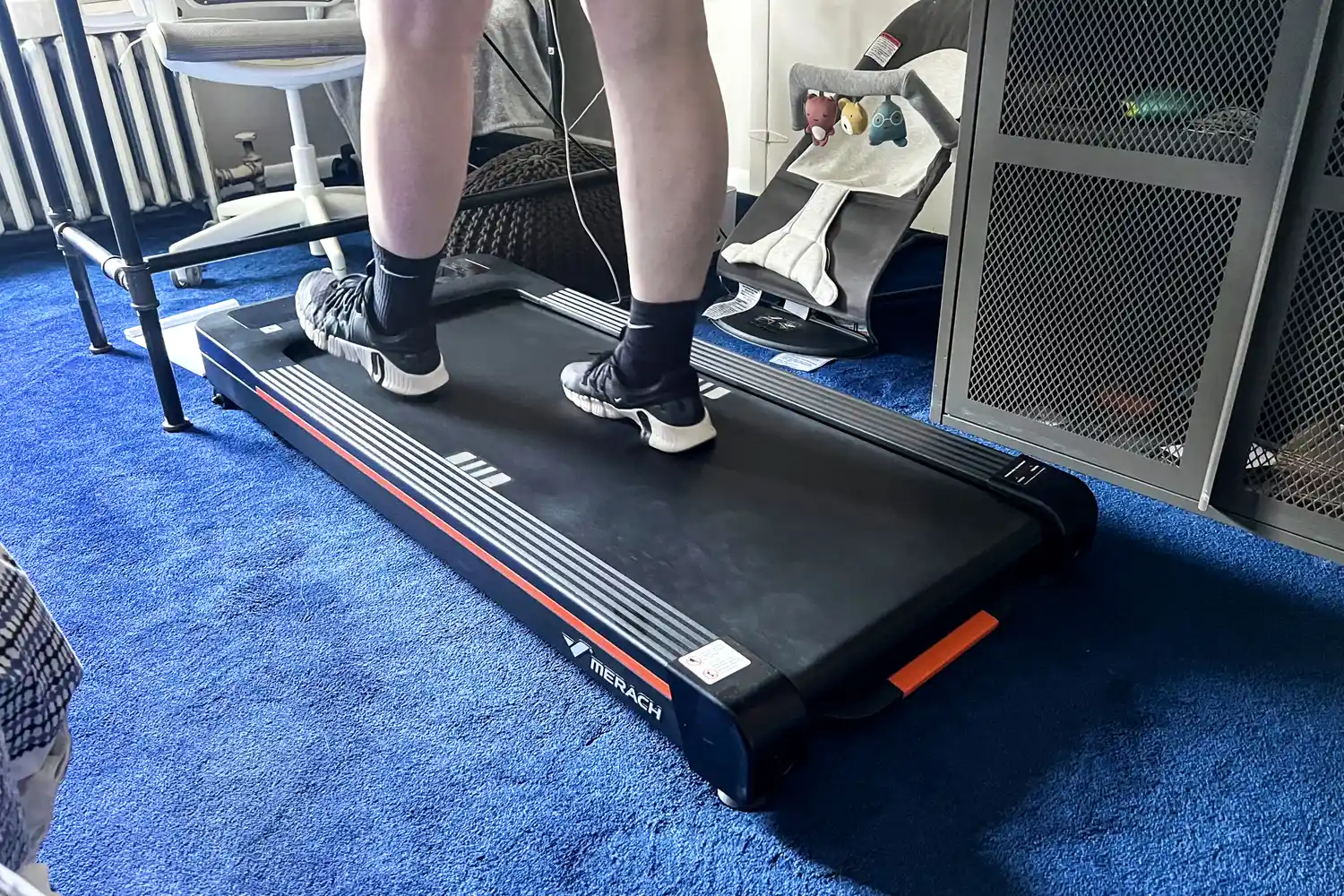 A person walks on the Merach NovaWalk W50 TrekPad with Incline 