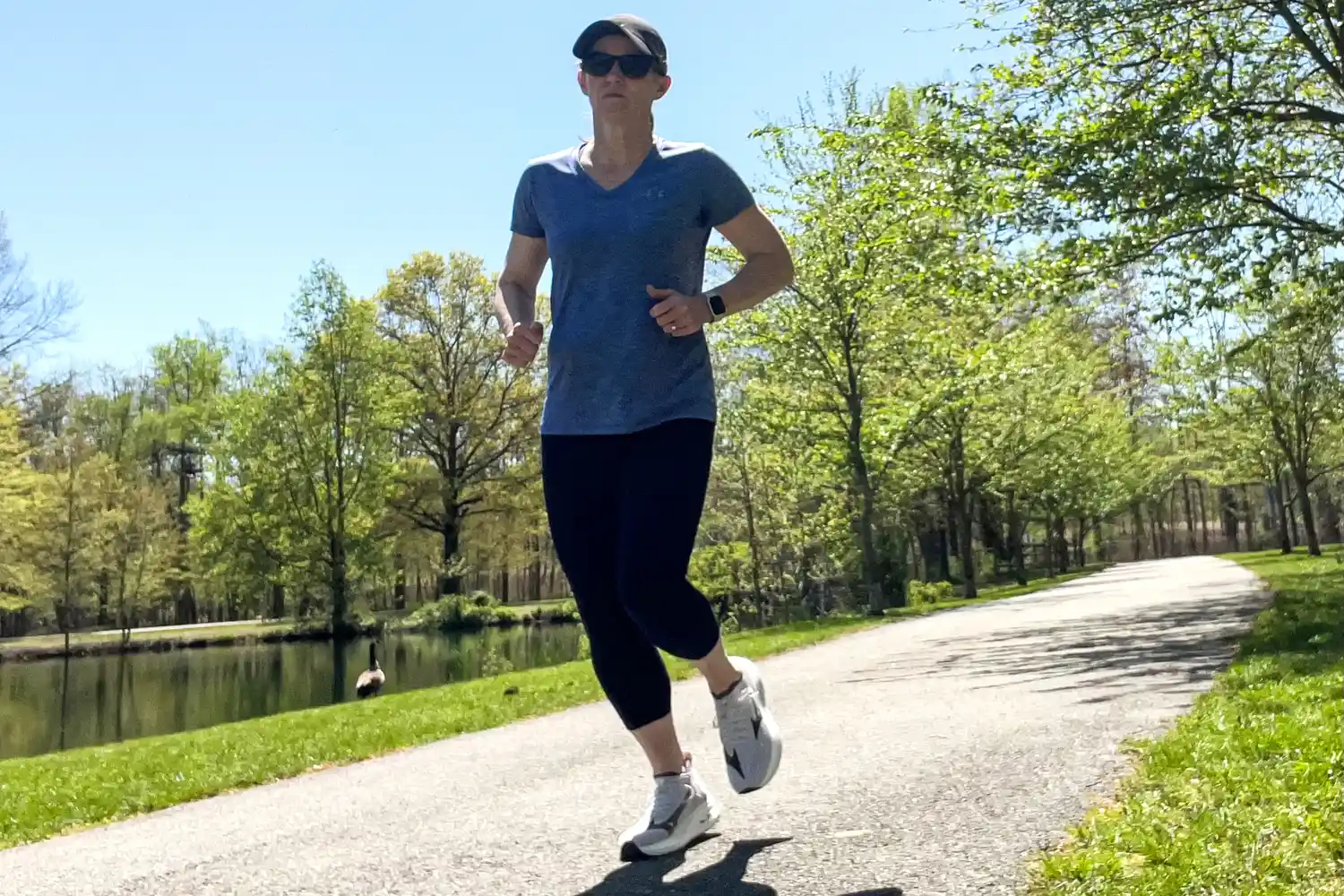 A person runs outside while wearing the Mizuno Women's Neo Zen Running Shoes
